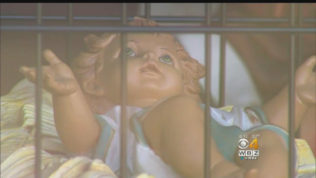 Baby Jesus In Cage As Part Of Dedham Church's Immigration-Themed Nativity Scene