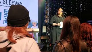 Lori Knight speaks at the "Songs for Tomorrow" Aaron Carter Benefit Concert