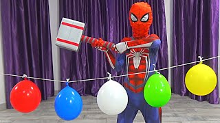 Spider Man popping colored water balloons