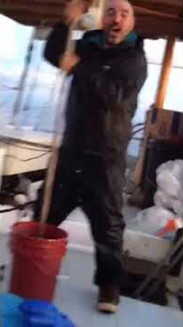 Khalid washing his socks on his Tuna boat!