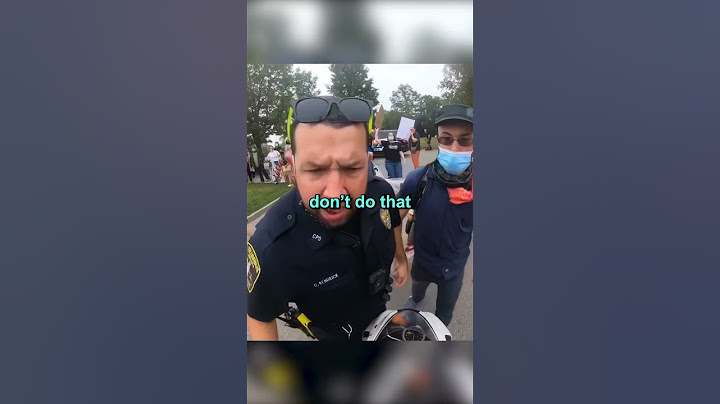 Protesters try to stop biker in the middle of the road 😱
