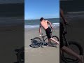 Moonwalking on the beach whilst on a bicycle