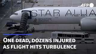 One dead, dozens injured as Singapore-bound flight hits turbulence | AFP