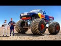 F1 Drivers Race HUGE Mega Trucks! (Max Verstappen vs Yuki Tsunoda)