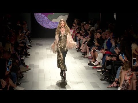 Gigi Hadid loses her shoe while on the runway for the Anna Sui Fashion Show