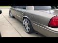 2001 Grand Marquis on 22’s with Flowmaster 40’s .