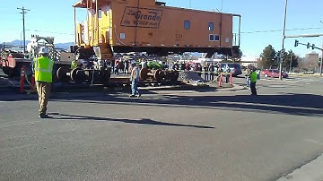 Caboose hobbies, Denver, installs a Rio Grand caboose outside.
