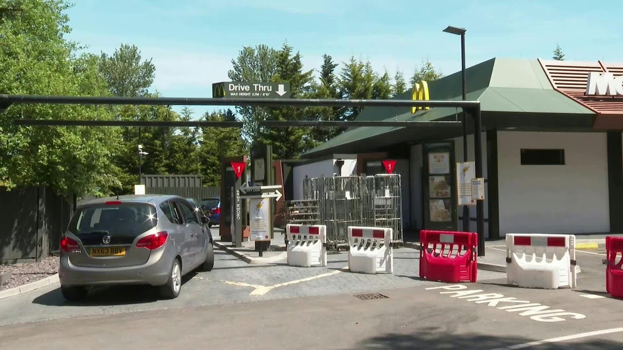 UK: Long lines as McDonald's reopens some restaurants for drive-through ...