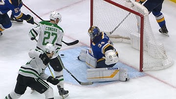 Jake Allen hustles back to kick the puck away