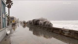 Giant waves crash over Mission Beach Boardwalk