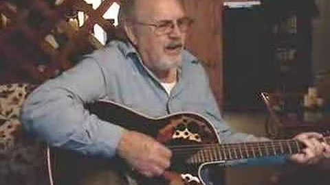 Danny Cohran playing and singing
