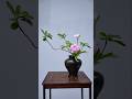 Making a table decoration from tree branches and flowers placed in a large jug vase #handicrafts