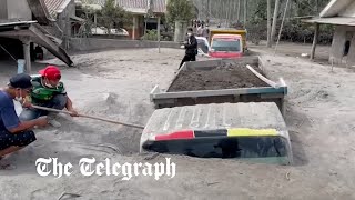 Villages in East Java are blanketed in ash from Semeru volcano