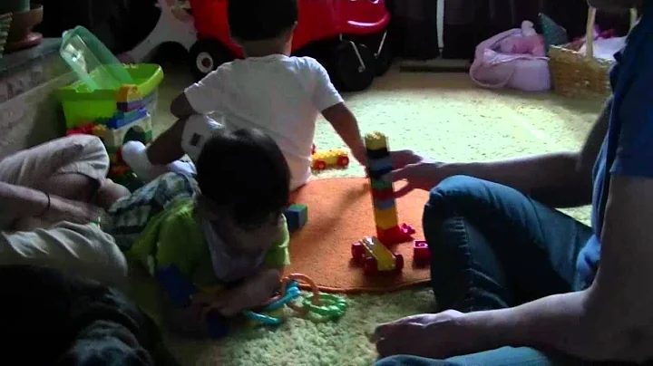 Renee, Nicholas, Zachary, and Grandma build with t...