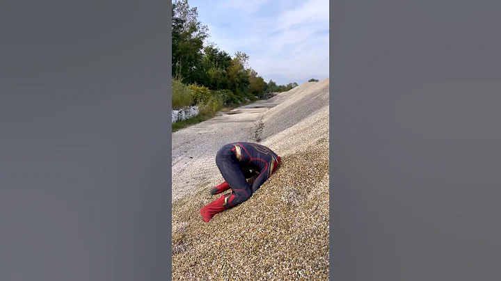 Spiderman's Head Stuck In Sand