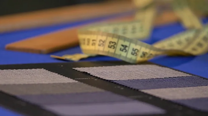 footage of a tailors meter ruler and some fabric l...