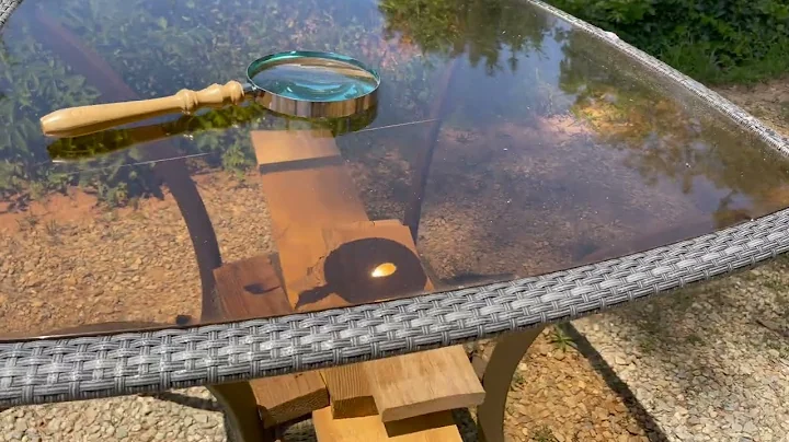 Magnifying Glass Focusing Through a Glass Table Top and Igniting a Fire