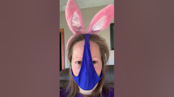Girl Wearing Bunny Ears Uses a Thong as Protective Mask to Cover Her Face