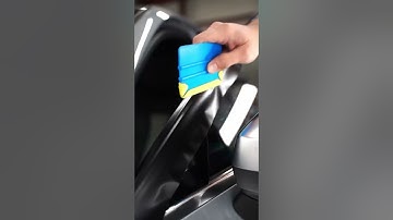 Applying Chromorpher Vinyl Tape Roll On A Cars Window Trim. Chrome delete.