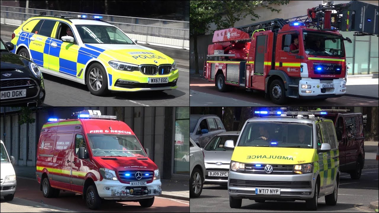 Fire Trucks, Police Cars and Ambulances responding with siren and lights in Bristol
