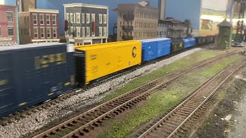 Ho Scale CSX EMD GP38-2 # 2640 pulling a long freight train through the city. 600 subscriber special