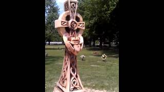 This is a carving of a cross holfing a heart on-site at a cemetery. It took two days to complete.