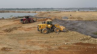 Best Wheel Loader Vs Bulldozer Heavy Equipment Operator Filling Huge Lake With Dump Truck Unloading