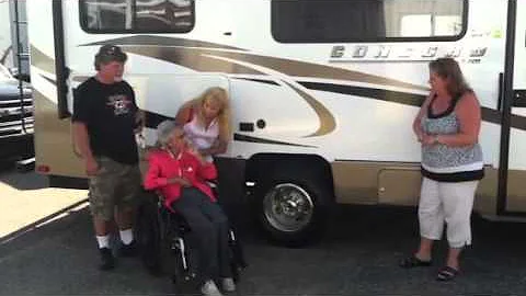 Brenda Truitt kicks a tire