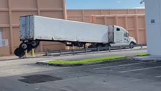 Semi-Truck Loses Back Wheels Trying to Turn Around Safety Barriers screenshot 4