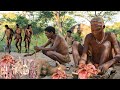 Hadzabe tribe hunt catching birds meat and cooking on forest morning