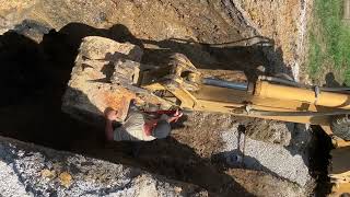 John Deere 710 Backhoe riding bucket 20 feet deep