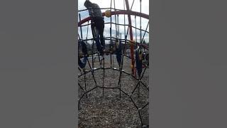 Funny girl stuck on playground