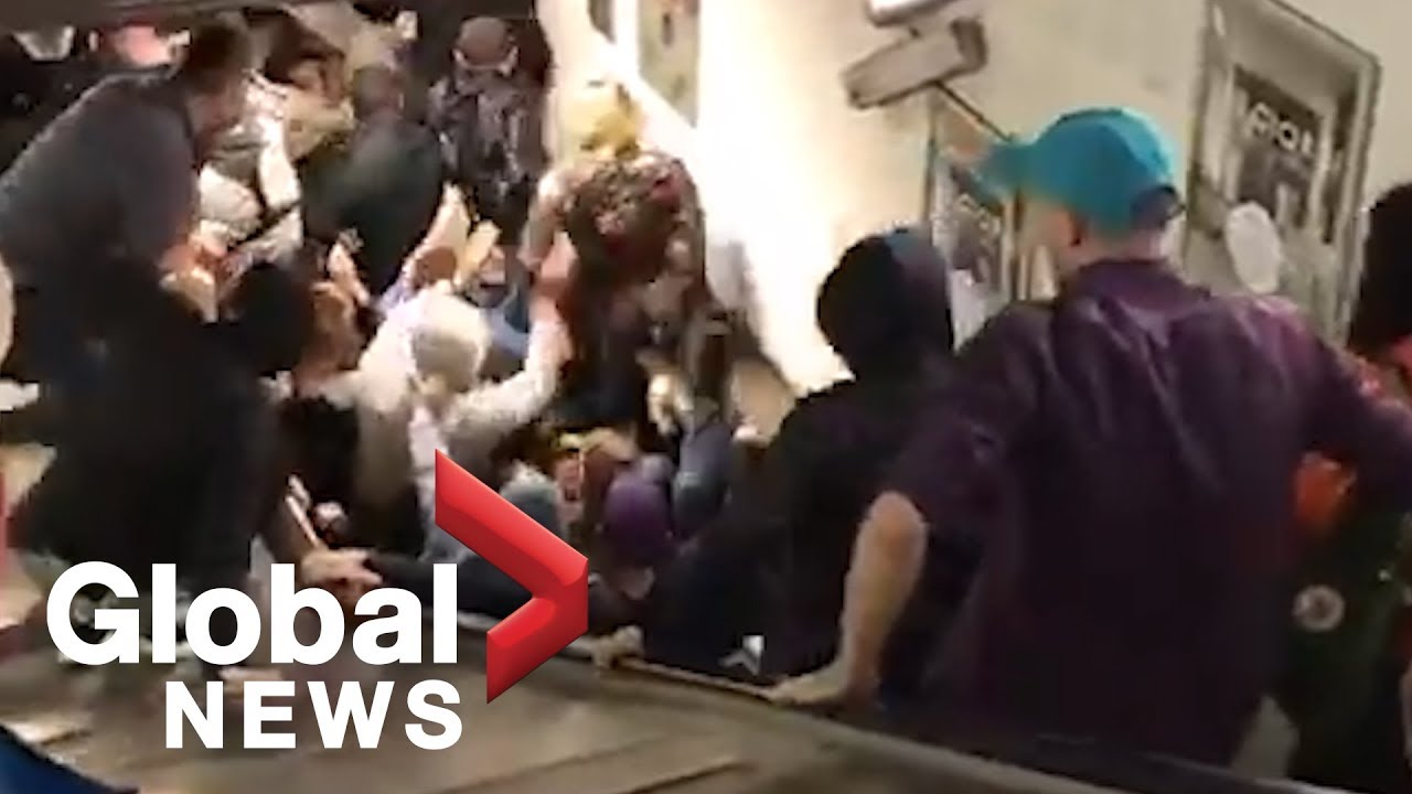 Scary escalator malfunction inside Rome metro leaves soccer fans seriously  injured - YouTube