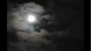 drifting clouds in moonlight