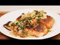 BLACKENED SALMON SMOTHERED IN TUSCAN CREAM SAUCE