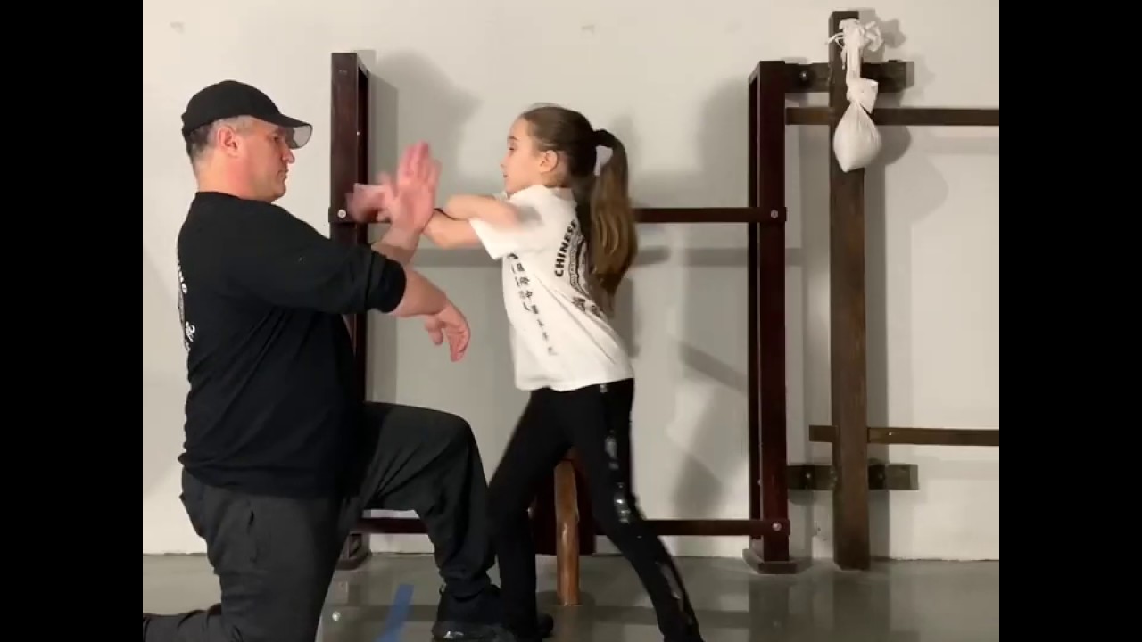 Wing Chun Girl Sabella Caucci works on the Wooden Dummy and some advanced Wing Chun Trapping