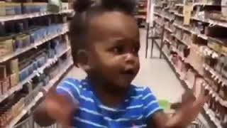 Baby "flirts" with gorgeous man in grocery section