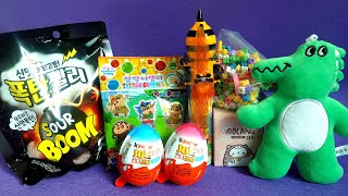 bomb gummy, crayon Shin-chan, bee car, block assembly, cat figure, crocodile doll, kinderjoy