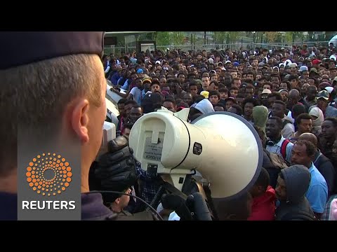 French police evict migrants in northern Paris - French police evict migrants in northern Paris