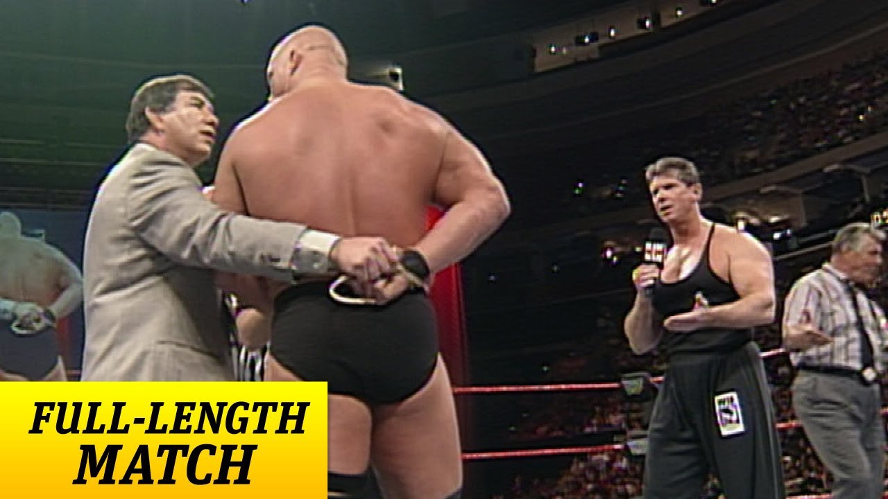 "Stone Cold" Steve Austin battles Mr. McMahon with one arm tied behind his back