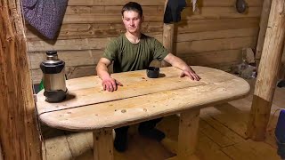 I live with my dog in the taiga in a dugout  I made a beautiful wooden table in a dugout!