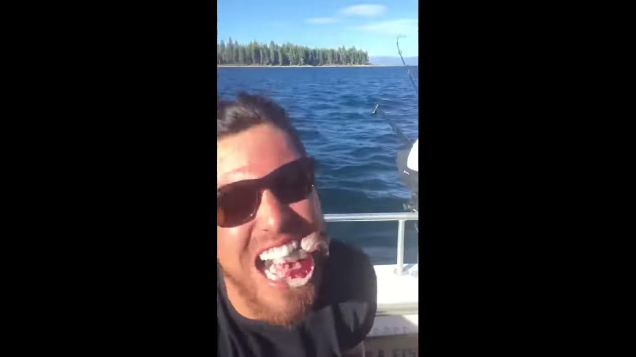 Demented Guy Bites Head Off Fish Really Nuts Youtube
