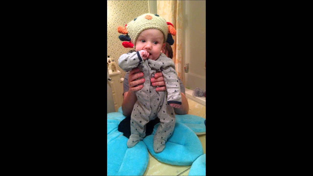Mirror baby wears w turkey hat