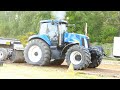 Different New Holland Tractors in front of the sledge doing some Tractor Pulling