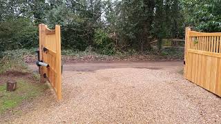 hardwood electric gate with above ground motors - driveway gates
