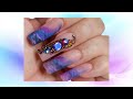 Kaleidoscope effect crystal nail art with marble fade