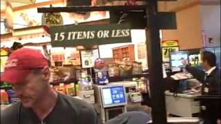 Weird Al Yankovic repairs a sign in a grocery store