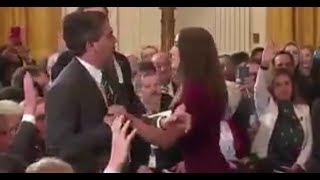 Jim Acosta Physically Refuses to relinquish mic to Female White House staffer