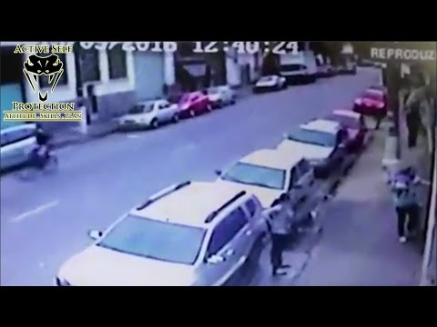 Father Holding His Child Shoots Armed Robber