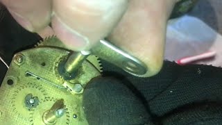 RELEASING tension on the “main spring” of a clock movement (letting down the main spring)…